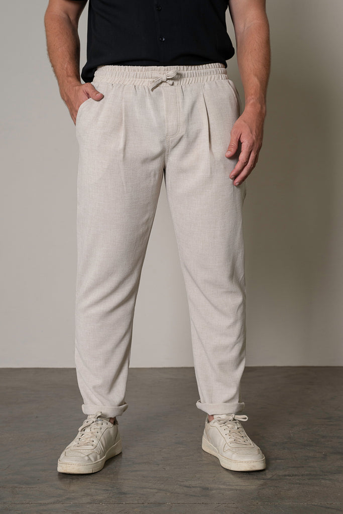 Front Close-Up View
"Close-up front view of men's lightweight tailored drawstring trousers in sand beige, highlighting the drawstring waist and slim, tailored fit. Perfect for a casual or semi-formal look, these breathable pants feature  a polished finish."
