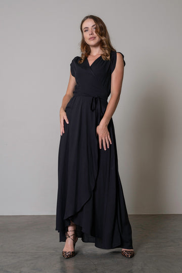 Maxi length wrap dress in a black with a waist tie and flattering silhouette